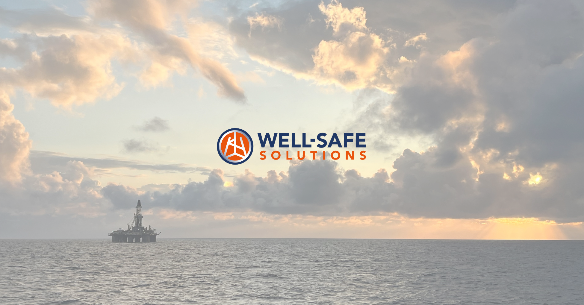 well-safe logo, with rig on scenic landscape photo.